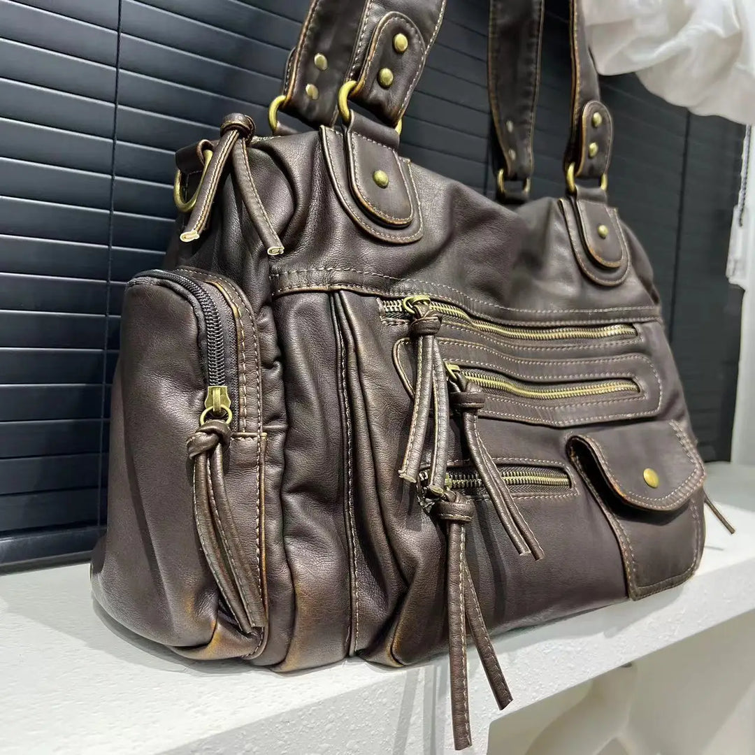 Borsa vintage con più tasche e aspetto elegante