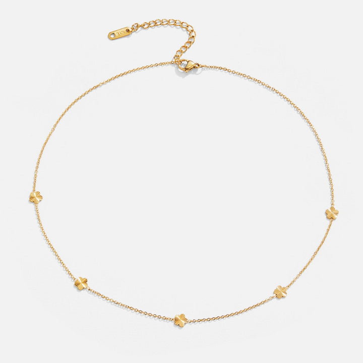Collana a catena dorata con motivo floreale