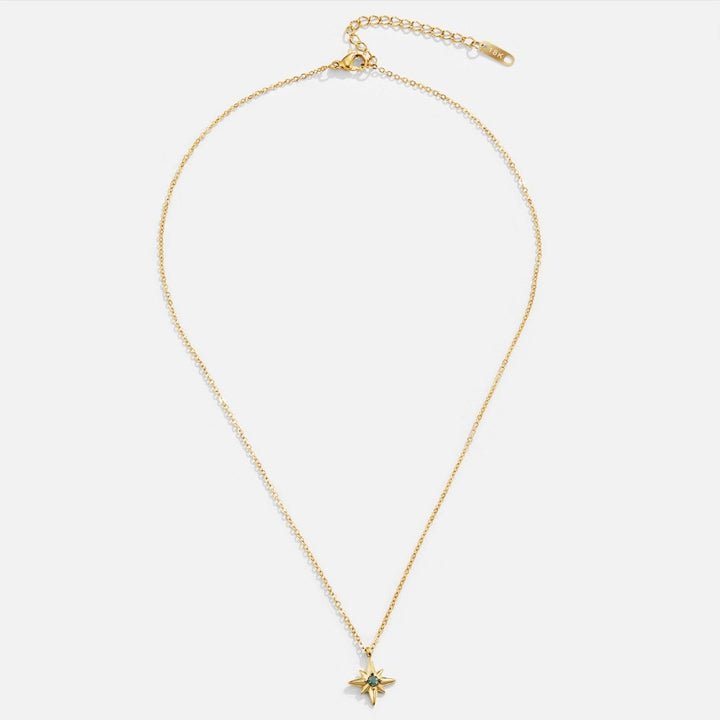 Collana con dettaglio verde, dettagli lucidi e stella