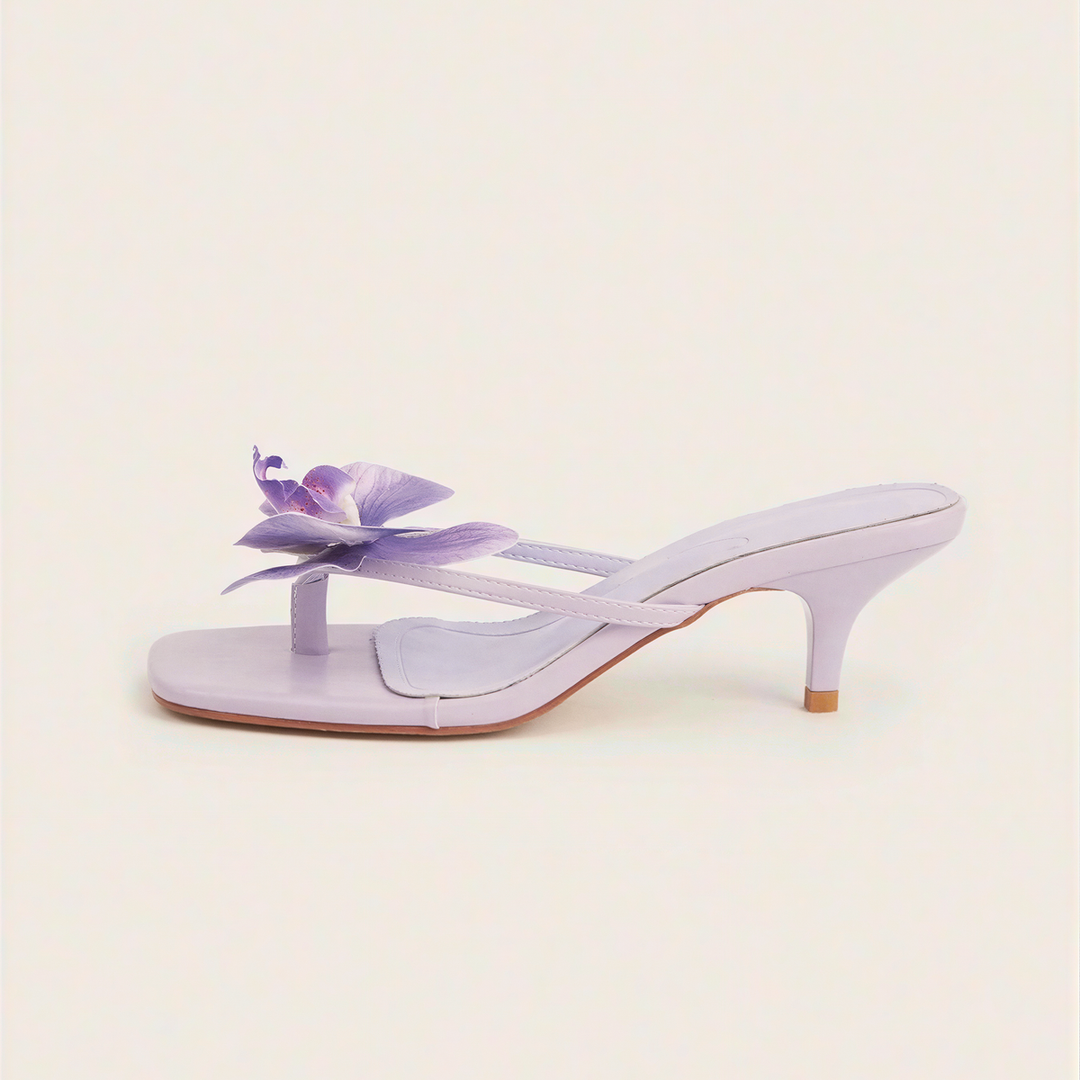 Sandali mule lilla con fiore e tacco basso